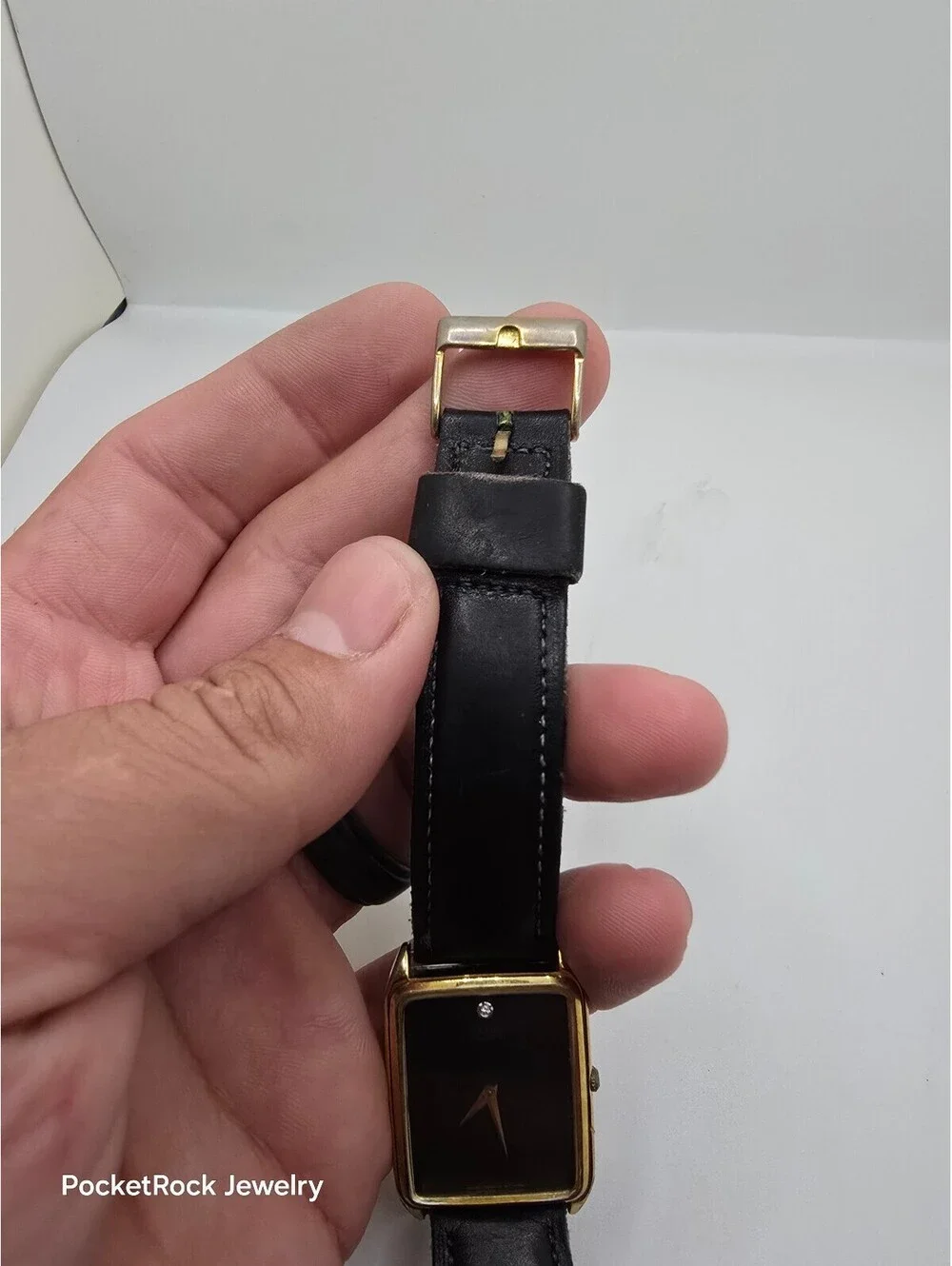 Seiko Quartz Rectangle Gold Tone Case Black Dial Black Leather Strap Watch